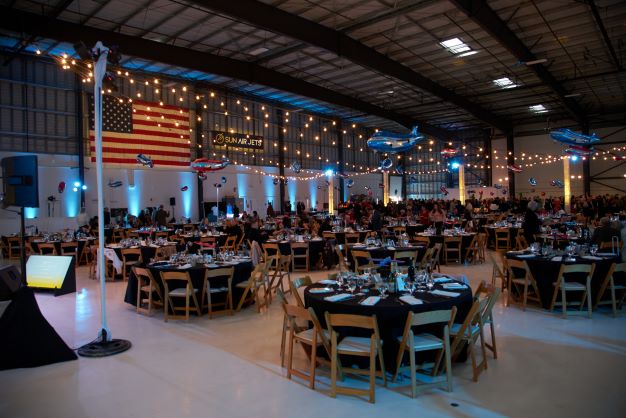 Live event services for a fundraising event in an airplane hanger