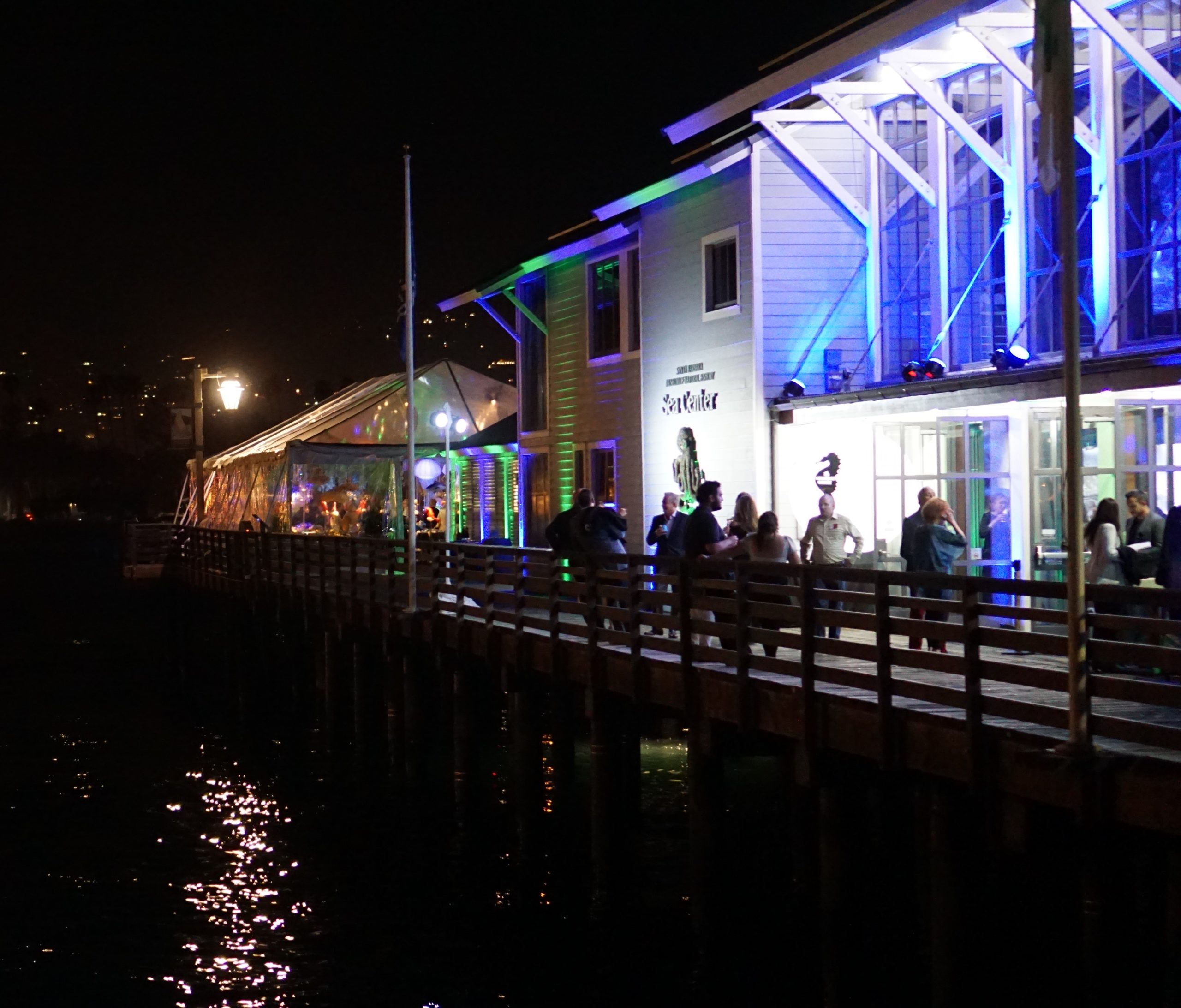 Live event services for a social event on a pier with a clear tent 